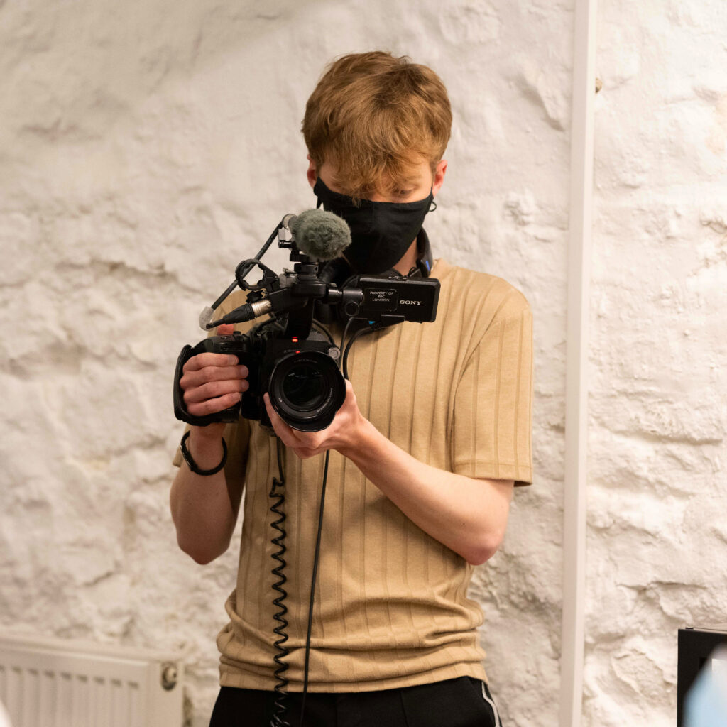 Jamie Moreland holding a camera