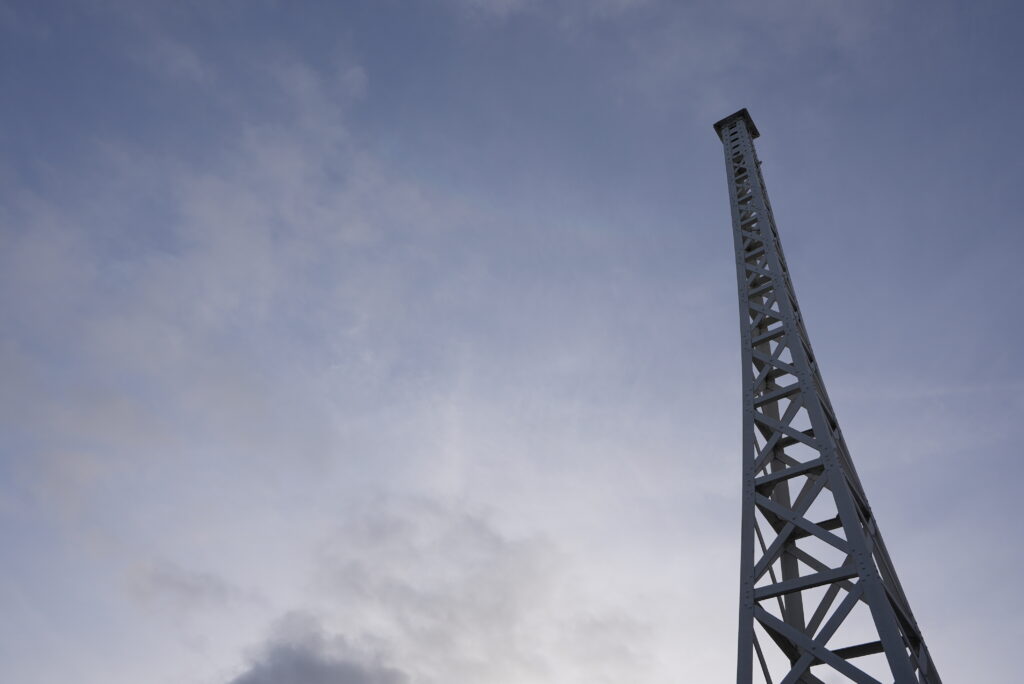 The old BBC transmitter on top of Old Broadcasting House in London, against a blue sky